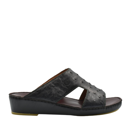 Black luxury ostrich sandals with textured leather upper and wedge sole from Private Collection