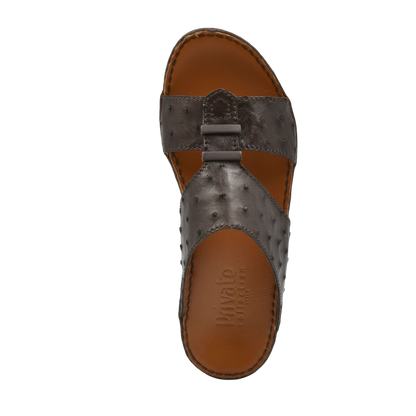 Top view of luxury ostrich sandals in dark brown leather with textured straps and cushioned sole