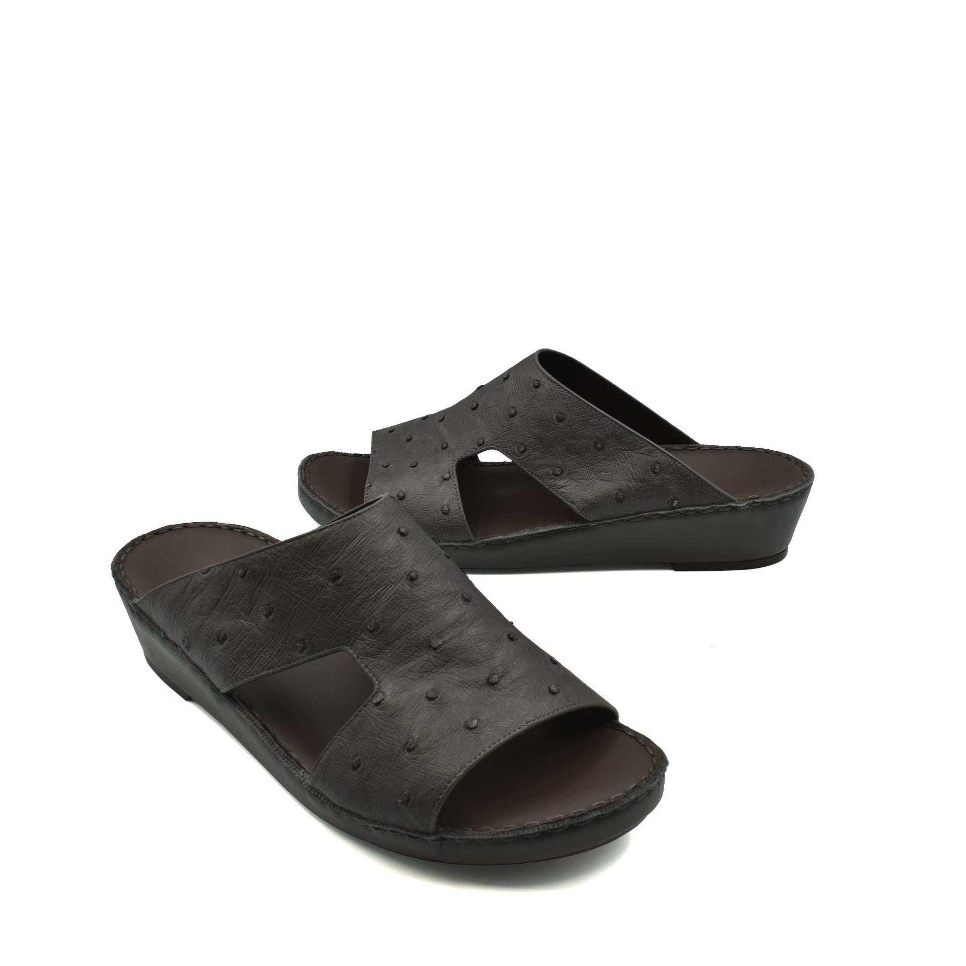 Black luxury ostrich sandals with open toe and low wedge heel for comfortable wear