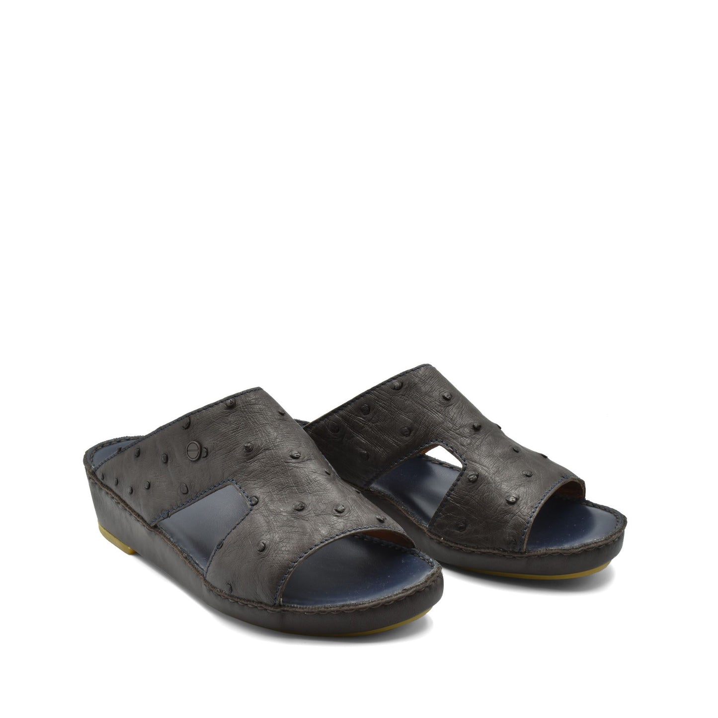 Pair of black luxury ostrich sandals with open toe and textured leather design