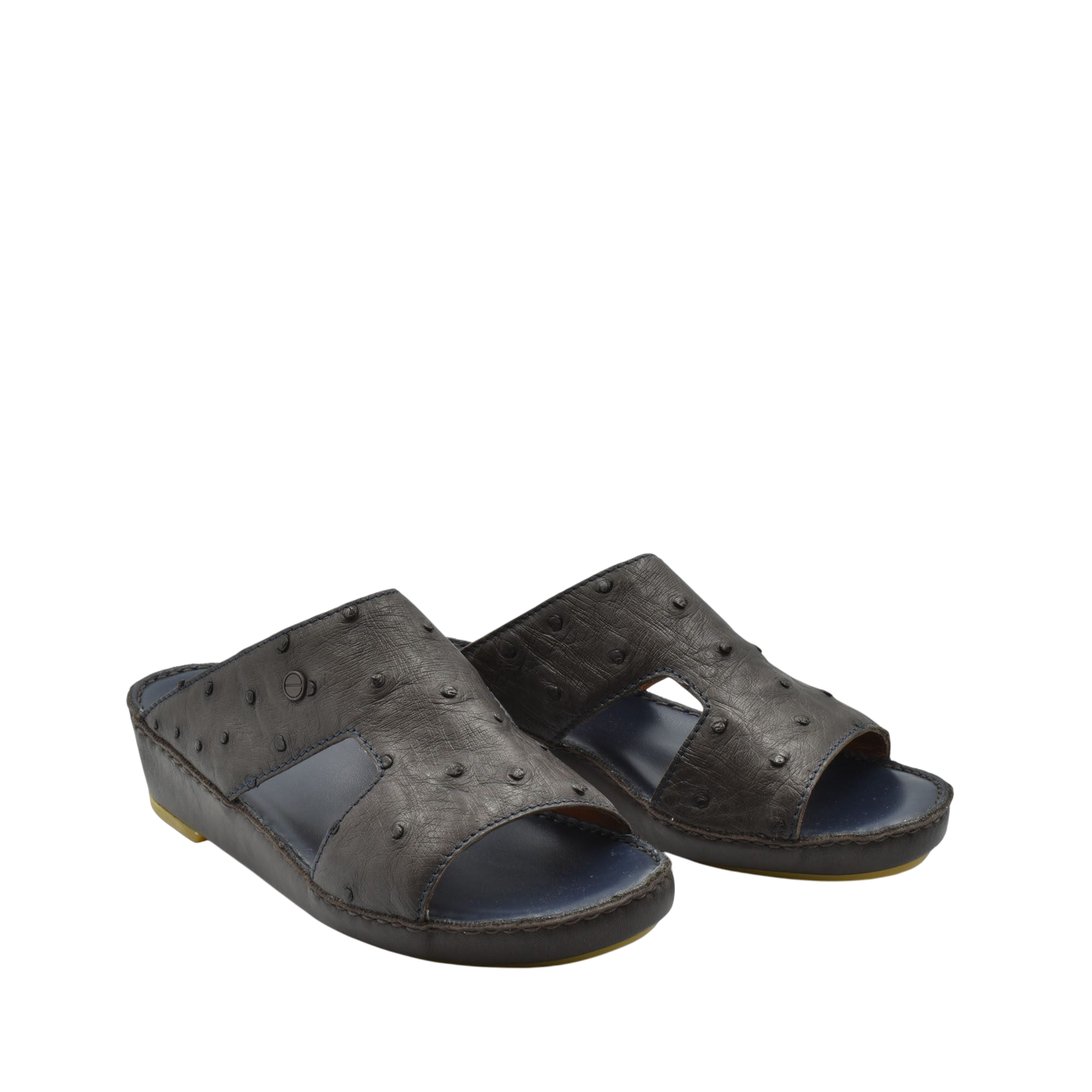 Pair of black luxury ostrich sandals with open toe and textured leather design