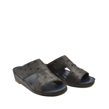 Pair of black luxury ostrich sandals with open toe and textured leather design