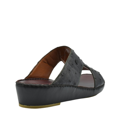 Black luxury ostrich sandals with open design and cushioned sole from Private Collection