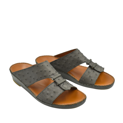 Black luxury ostrich sandals with open toe design and leather footbed from private collection