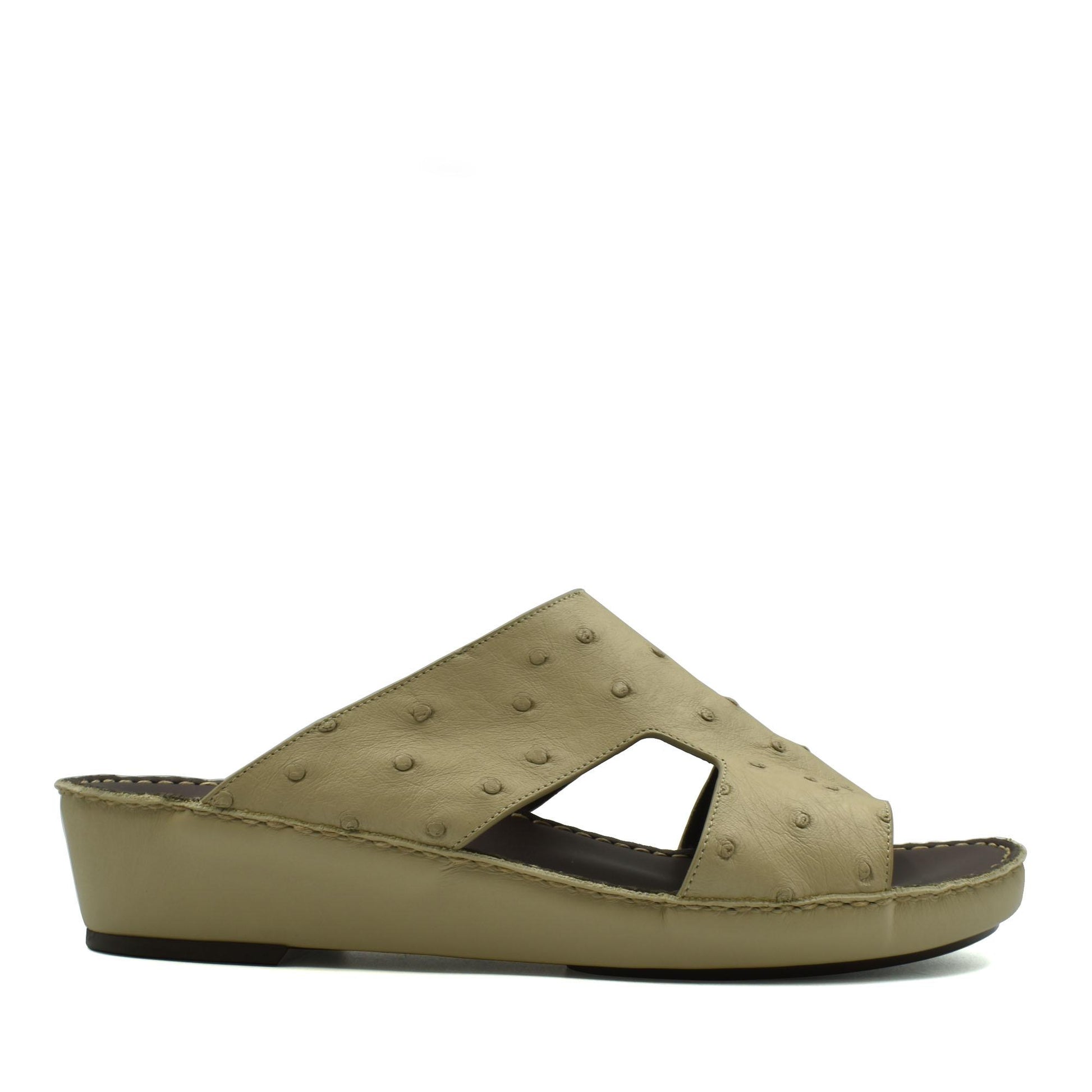 Beige luxury ostrich sandals with textured leather upper and wedge sole from private collection