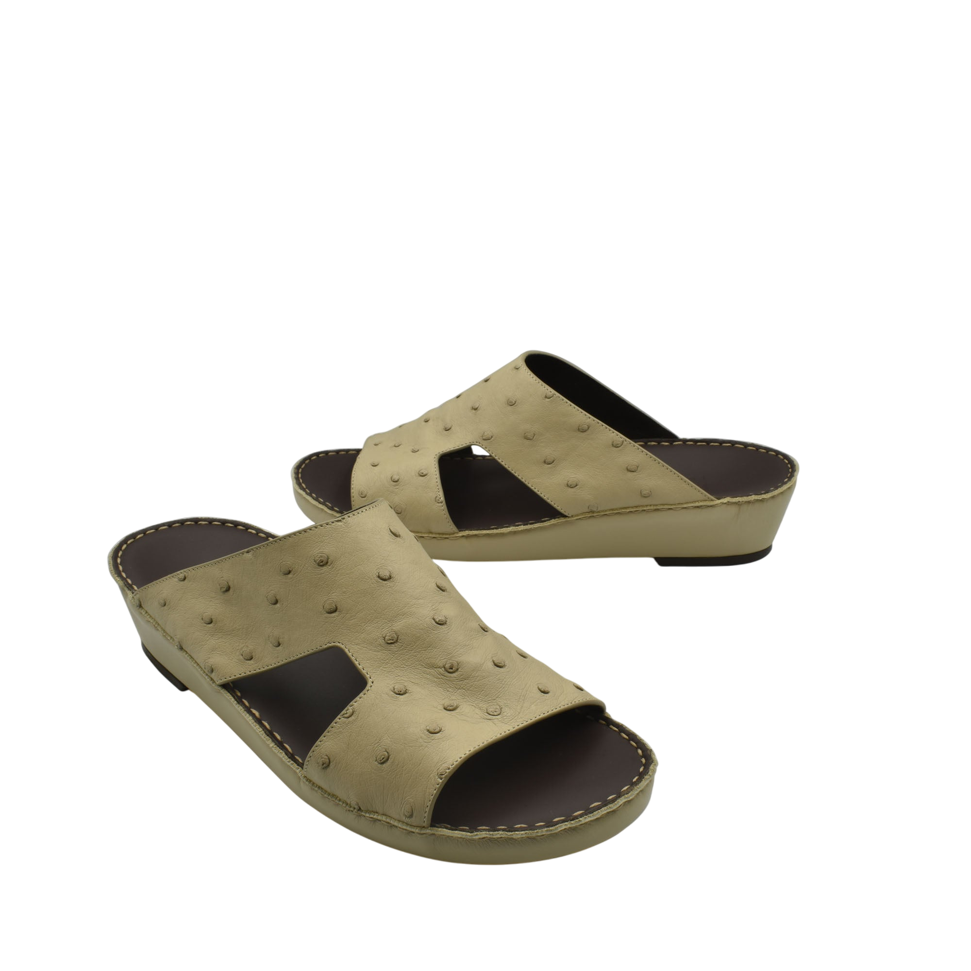 Beige luxury ostrich sandals with open toe and cutout design on leather sole