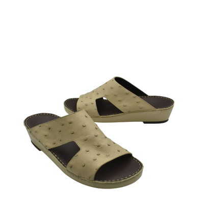 Beige luxury ostrich sandals with open toe and cutout design on leather sole
