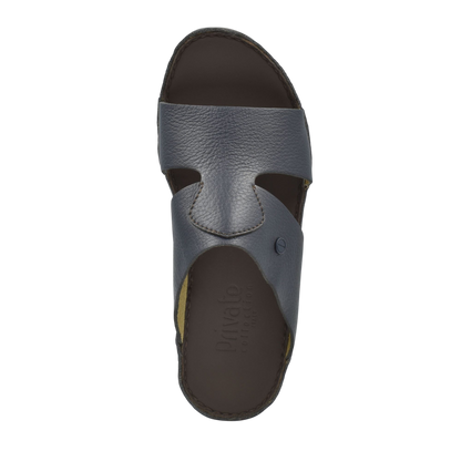 Top view of gray luxury slip-on footwear with open toe and textured leather upper