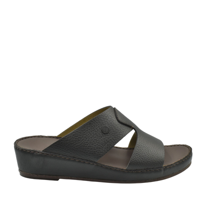 Black leather luxury slip-on footwear with open toe and cushioned sole from Private collection