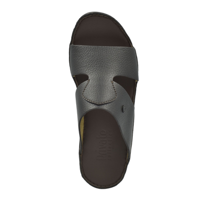Top view of brown leather luxury slip-on footwear with a textured finish and open toe design