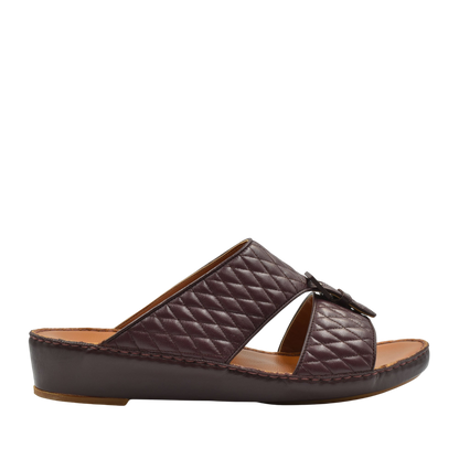 Brown quilted luxury slip-on footwear with cushioned leather sole and open toe design