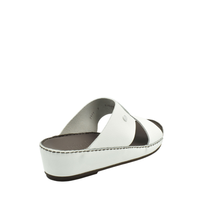 White luxury slip-on footwear with cushioned sole and open-toe design from Private Collection