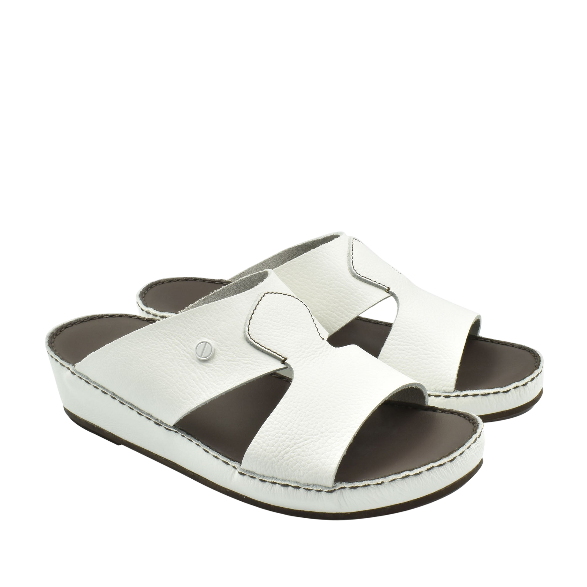 White luxury slip-on footwear with open toe and cushioned sole from Private collection