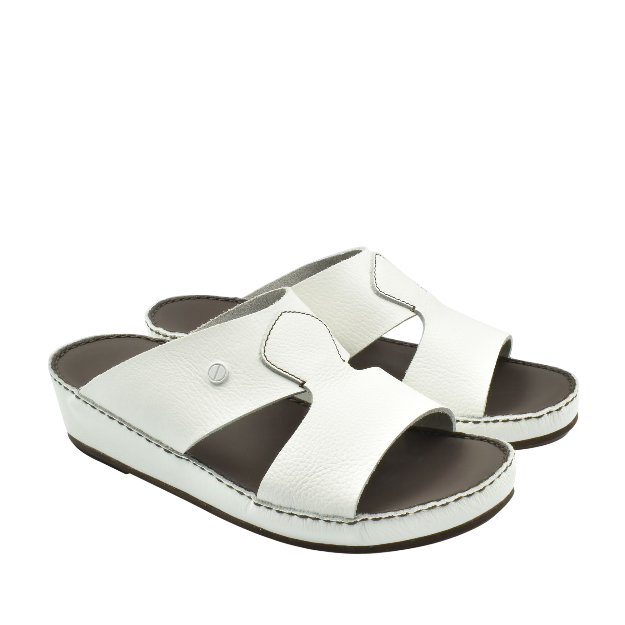 White luxury slip-on footwear with open toe and cushioned sole from Private collection