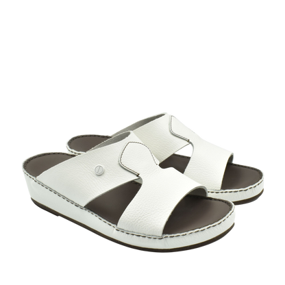 White luxury slip-on footwear with open toe and cushioned sole from Private collection