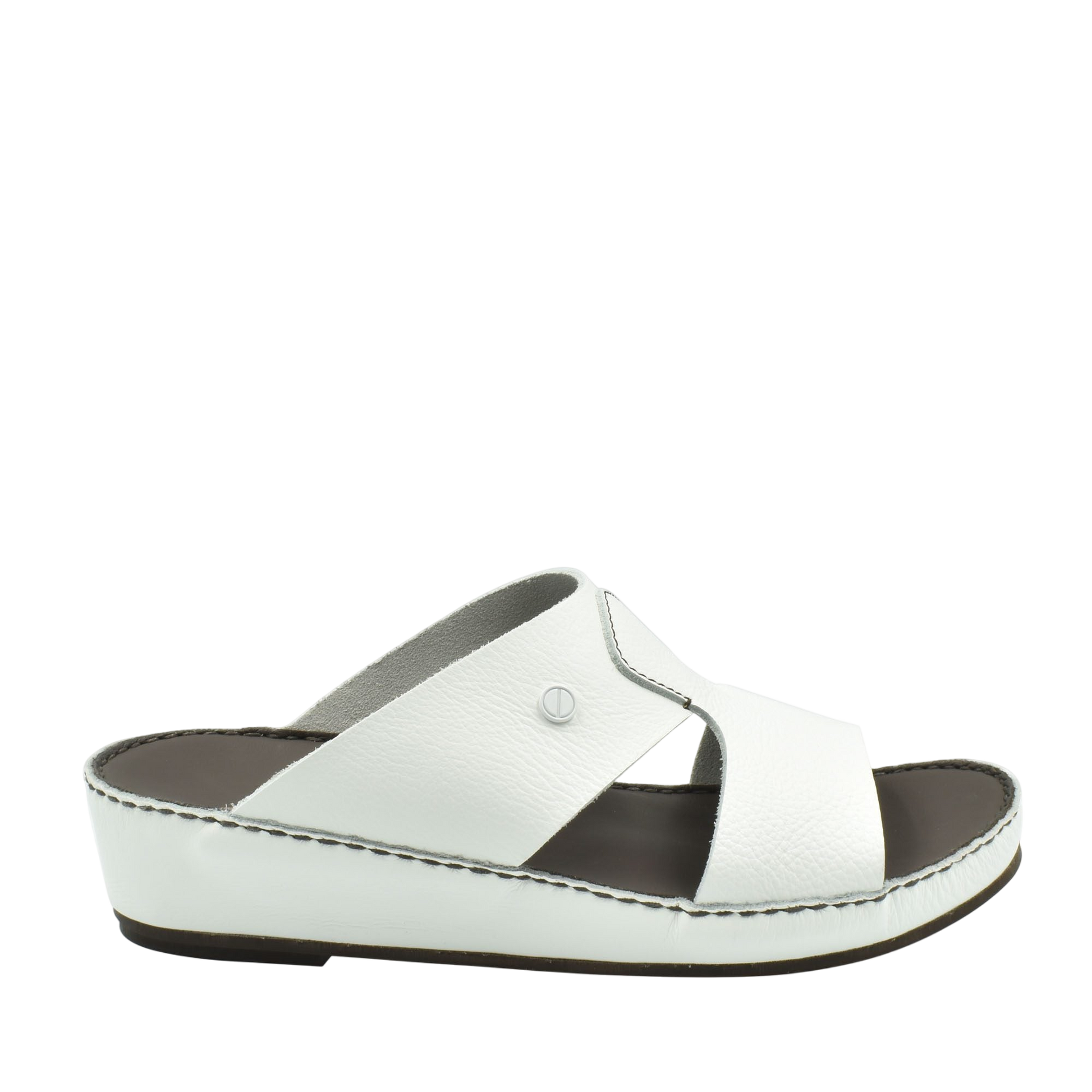 White luxury slip-on footwear with cushioned sole and cross strap design from private collection
