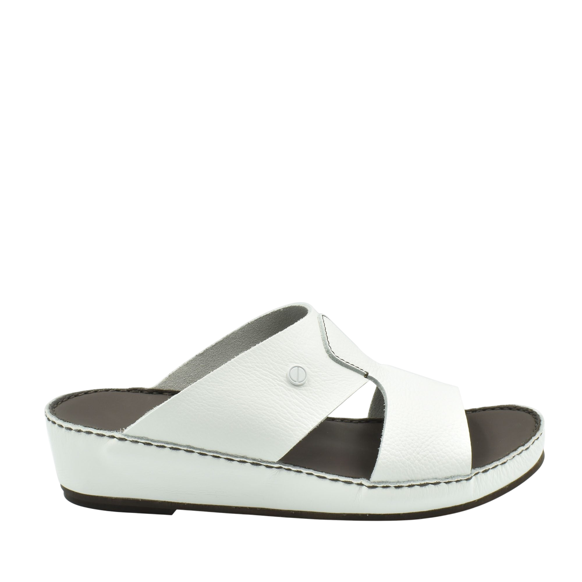 White luxury slip-on footwear with cushioned sole and cross strap design from private collection