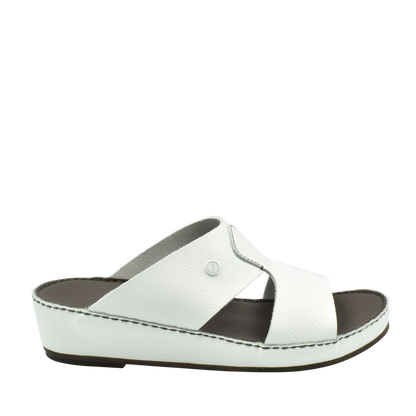 White luxury slip-on footwear with cushioned sole and cross strap design from private collection