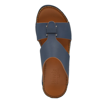 Top view of navy blue Manetta Rubbercalf sandals with brown footbed from Private collection