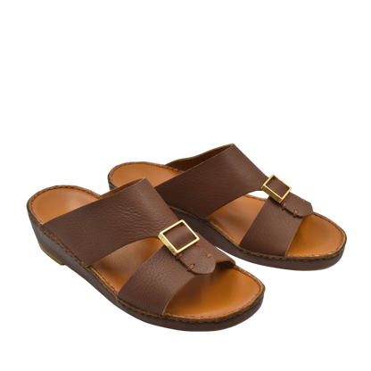 Brown leather metallic deercalf slides with gold buckle and cushioned sole for comfort