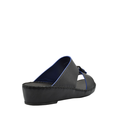 Black slip-on natural contrast sandals with blue trim and cushioned sole for comfortable wear