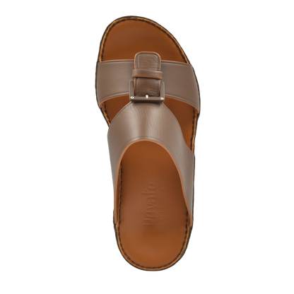 Top view of brown leather natural contrast sandals with buckle strap and stitched sole