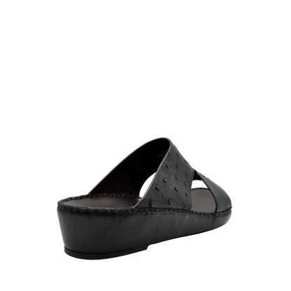 Black ostrich embossed slip on sandals with open toe and cushioned sole for comfortable wear