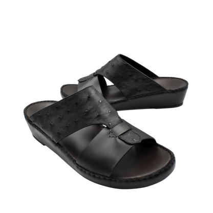 Black ostrich embossed slip on sandals with open toe and cushioned sole