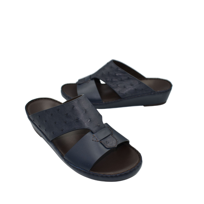 Black ostrich embossed slip on sandals with cushioned sole and open toe design