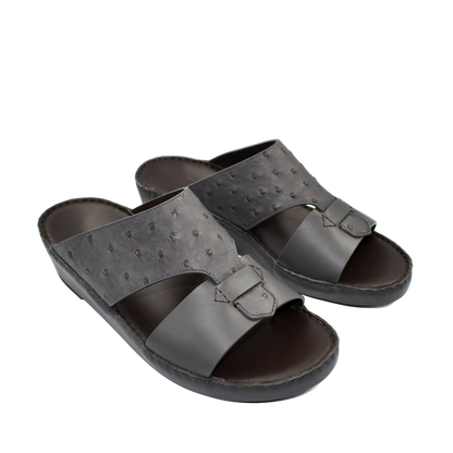 Black ostrich embossed slip on sandals with adjustable strap and cushioned sole