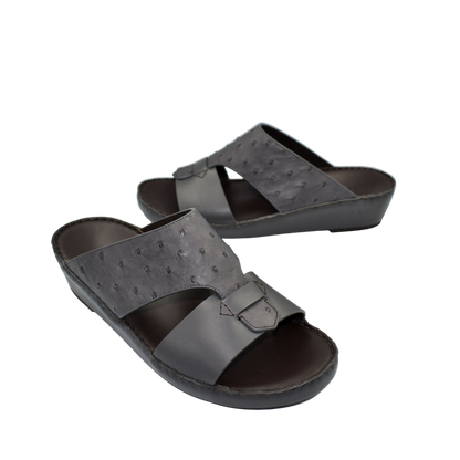 Black ostrich embossed slip on sandals with buckle detail and cushioned sole for comfortable wear