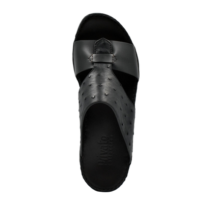 Black ostrich embossed slip on sandals with textured upper and open toe design from Private Collection