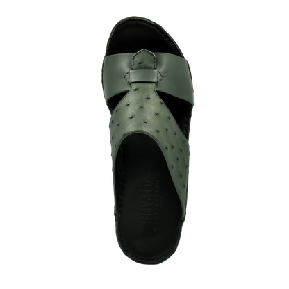 Top view of green ostrich embossed slip on sandals with cushioned black sole