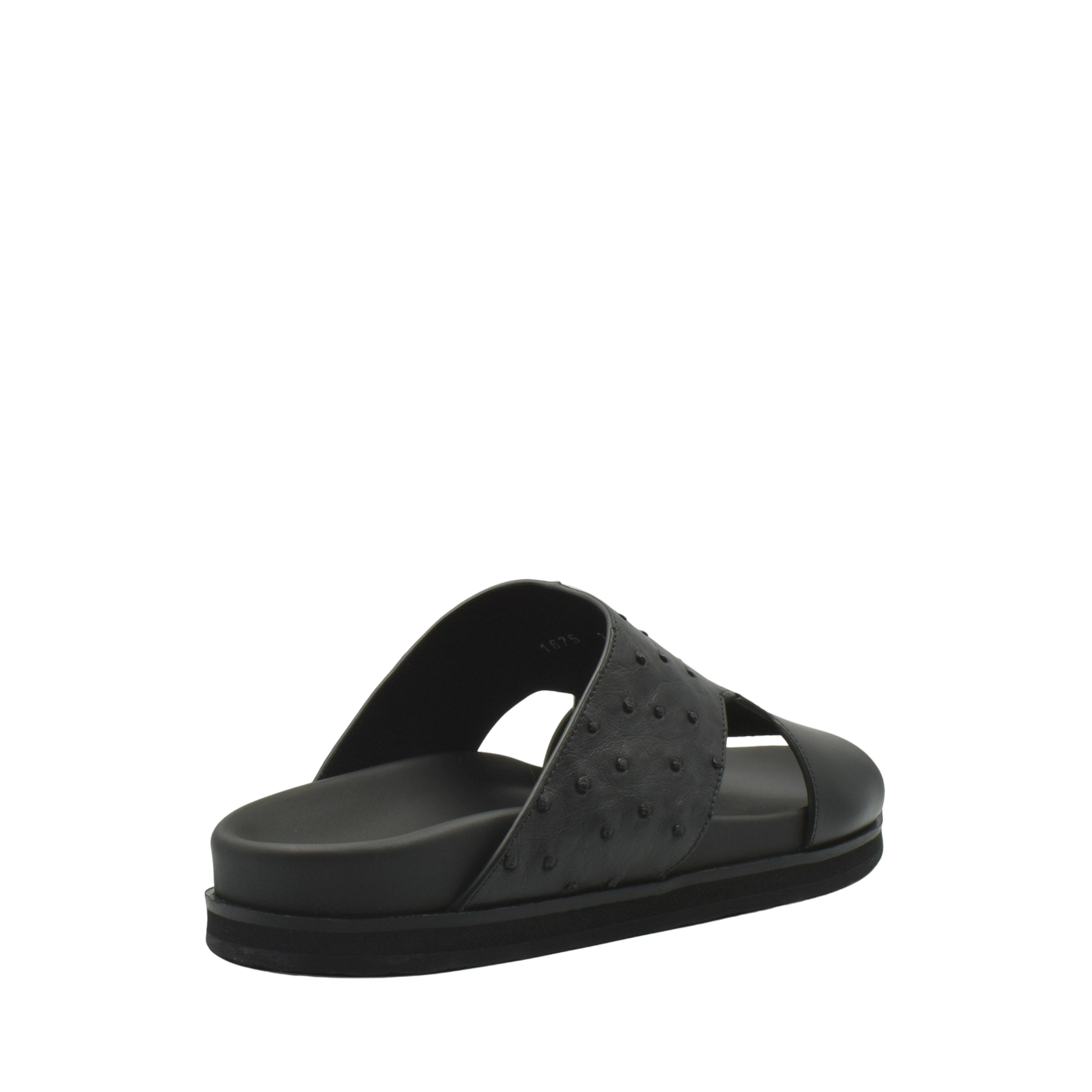 Black slide sandal featuring ostrich leather footwear with textured upper and cushioned sole