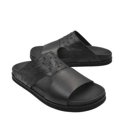 Black ostrich leather footwear slide sandals with textured upper and cushioned sole