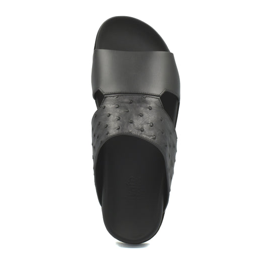 Black slide sandal featuring authentic ostrich leather footwear upper from Private Collection
