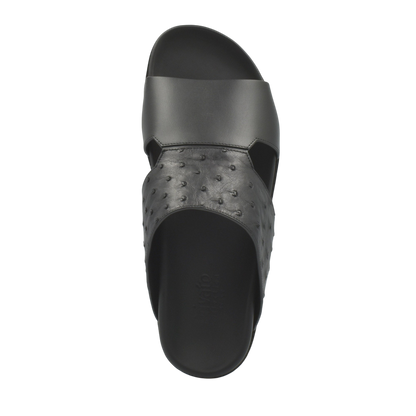 Black slide sandal featuring authentic ostrich leather footwear upper from Private Collection