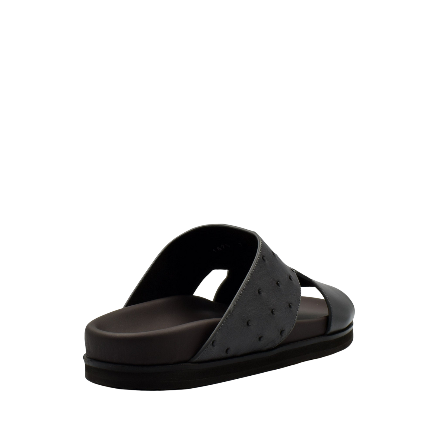 Black slide sandal from private collection featuring ostrich leather footwear design with textured upper