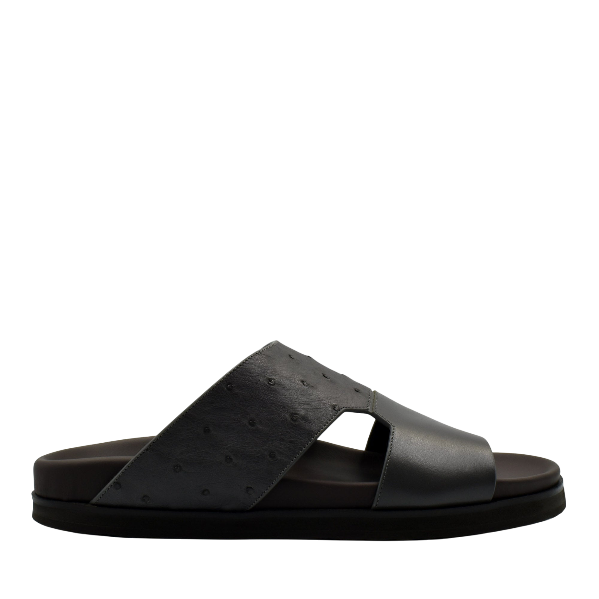 Black slide sandal featuring premium ostrich leather footwear with open toe and comfortable sole