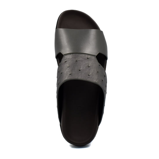 Top view of black ostrich leather footwear slide sandal with textured and smooth straps
