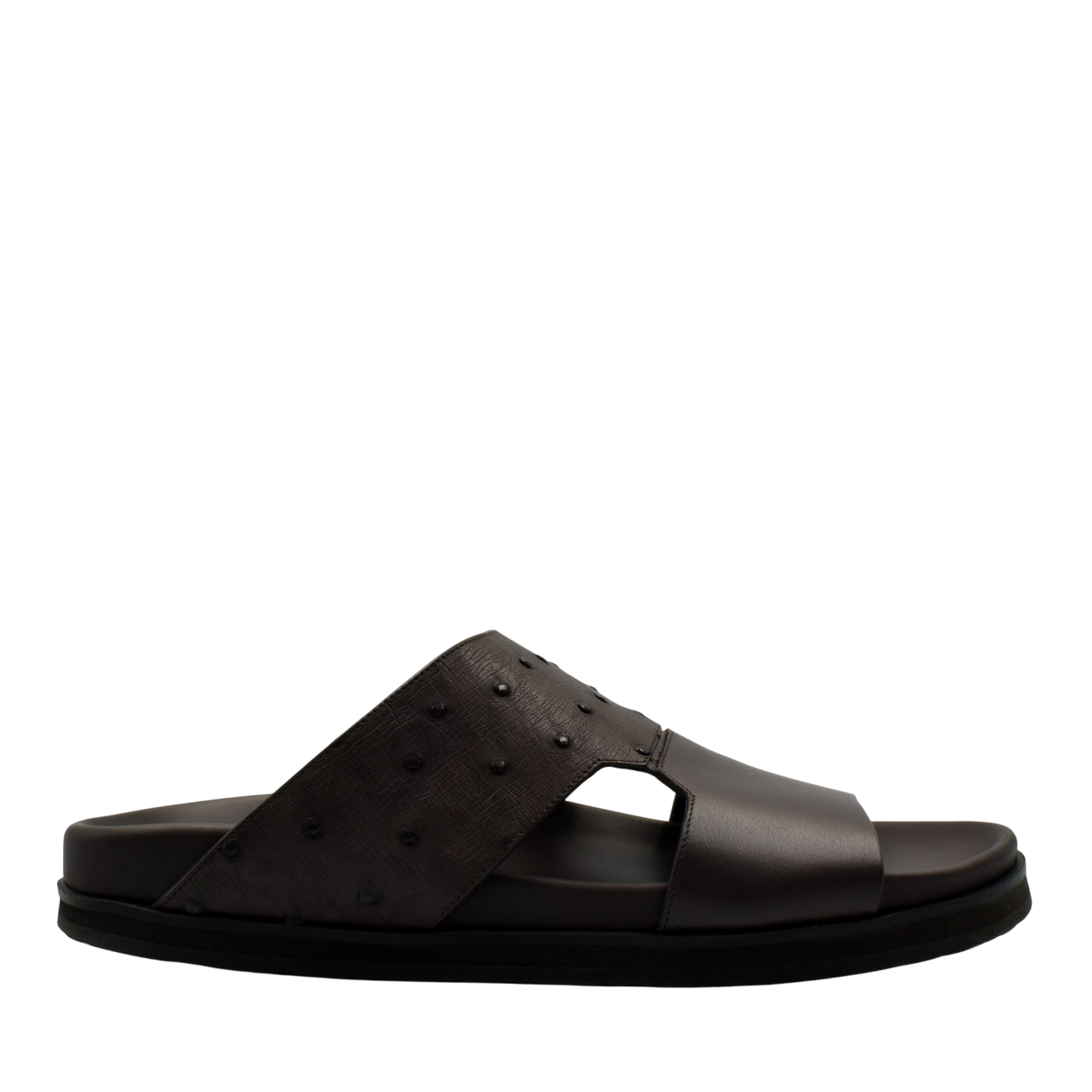 Black slide sandal featuring ostrich leather footwear with textured upper strap from private collection