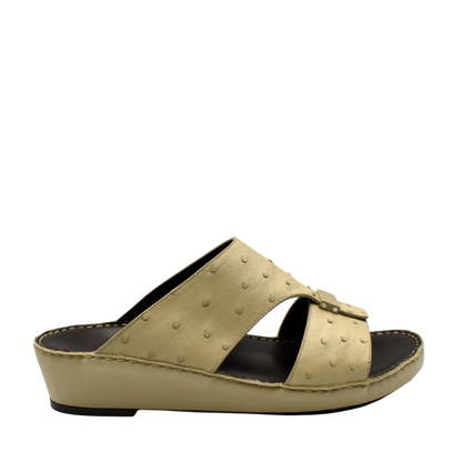 Beige ostrich leather sandals with a slip-on wedge design and textured leather upper