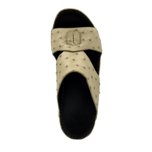 Beige ostrich leather sandals with textured straps and black sole from private collection
