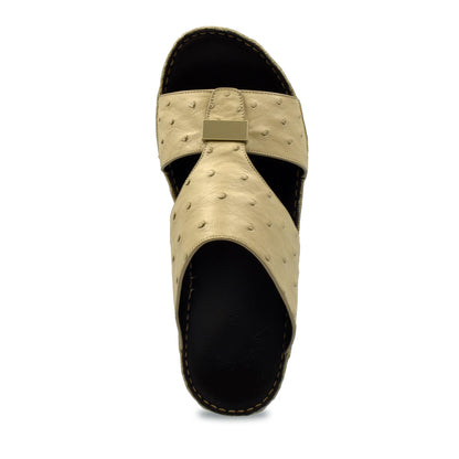Beige ostrich leather sandals with black sole and textured upper from Private Collection