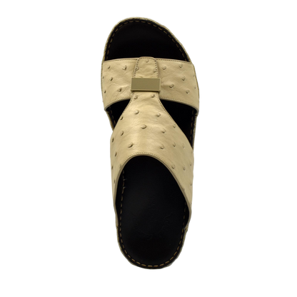 Beige ostrich leather sandals with black sole and textured upper from Private Collection