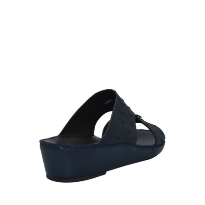Black ostrich leather sandals with cushioned wedge sole and open toe design from Private collection