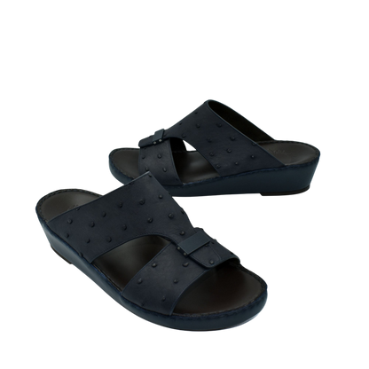 Black ostrich leather sandals with buckle detail and comfortable wedge sole
