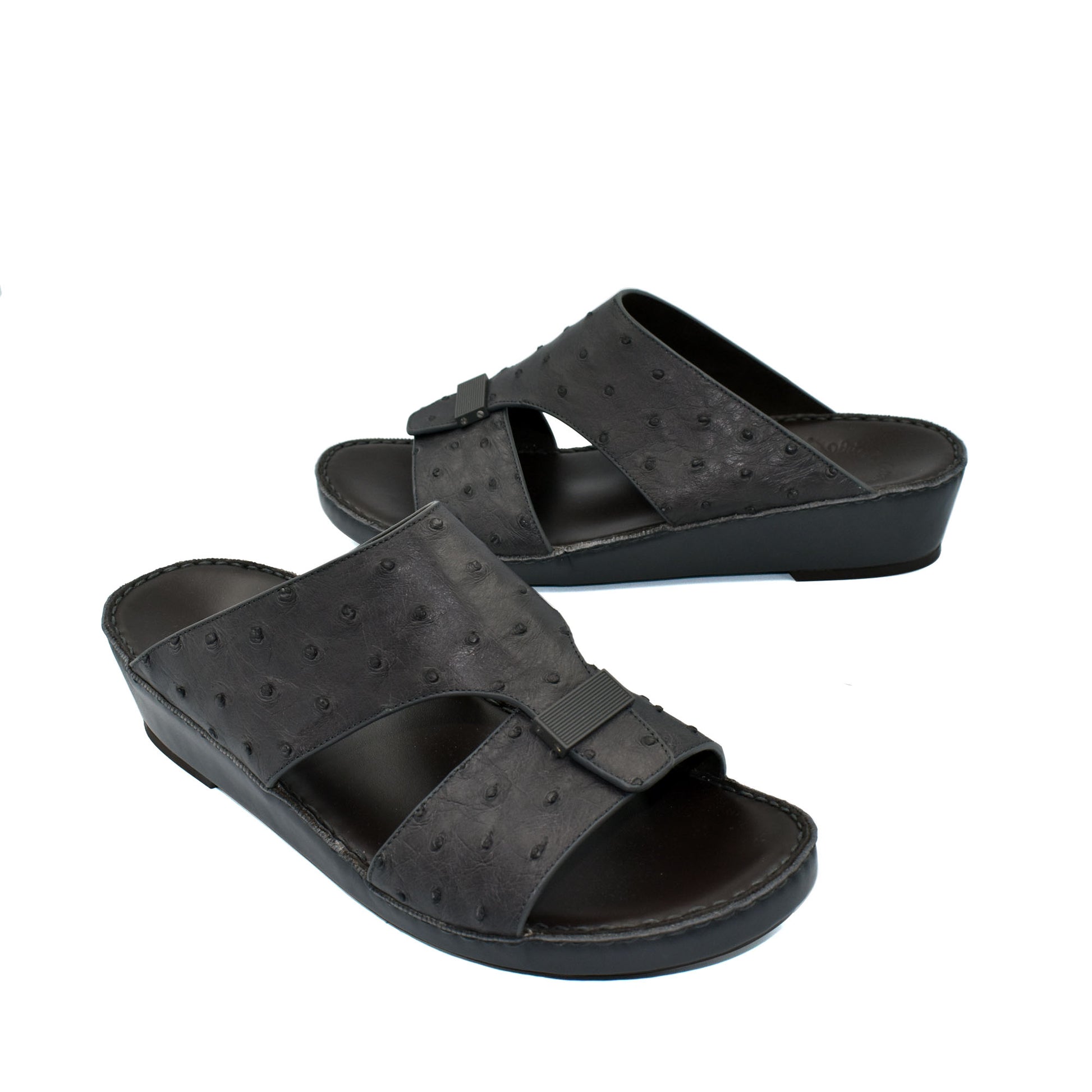 Black ostrich leather sandals with open toe and adjustable strap from Private Collection