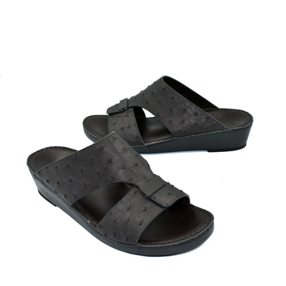 Black ostrich leather sandals with open toe and adjustable strap from Private Collection