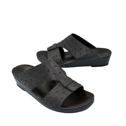 Black ostrich leather sandals with open toe and adjustable strap from Private Collection